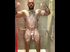 Straight lad Andy Lee playing with huge uncut cock in shower